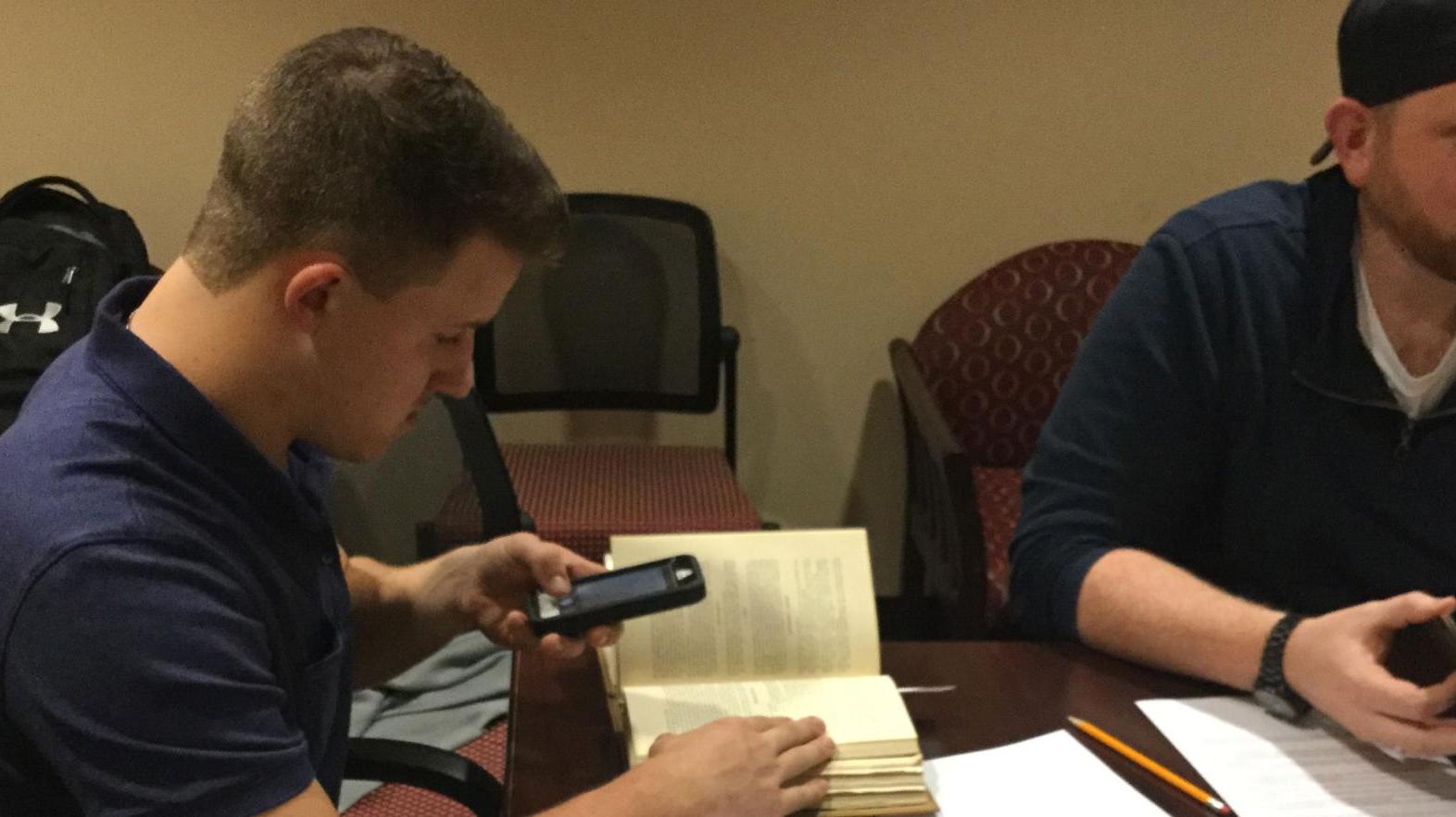 An American studies major does research in the archives for a project on Springfield College.