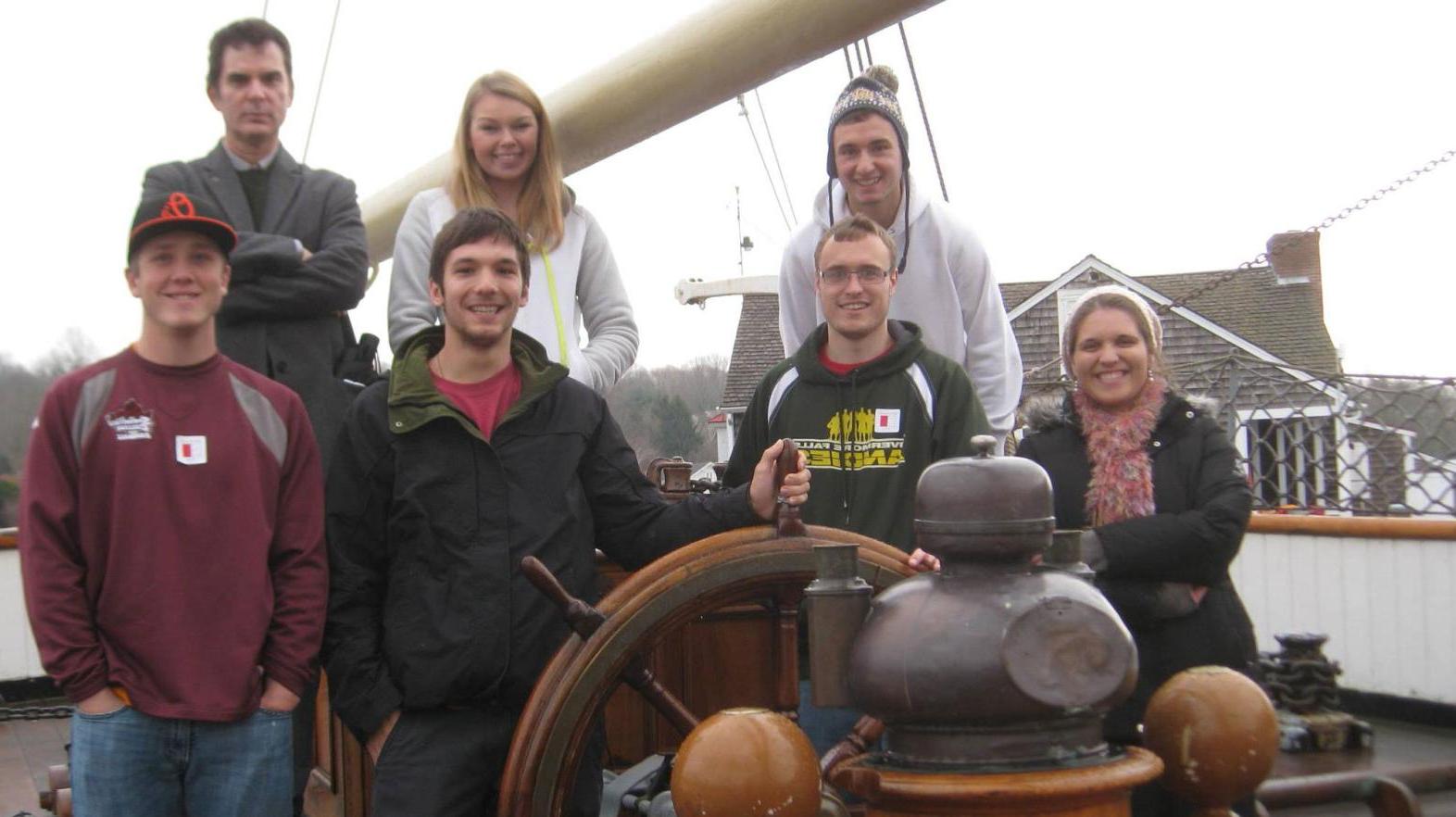 Students pose during a field trip to Mystic Seaport where at Springfield College alumna is employed.